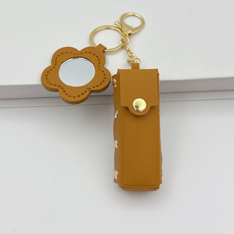 Flor espejo llavero cuero transfronterizo regalo colgante joyería creativo mini lápiz labial almacenamiento llavero colgante