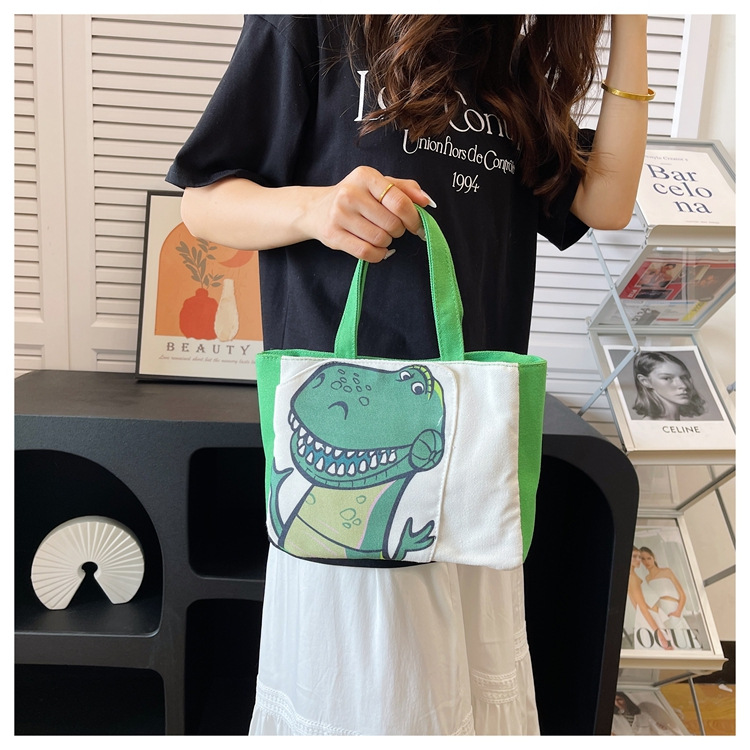 Cute cartoon printed small bag, 2024 summer new style hand-held piggy girl handbag, student storage canvas bag undefined