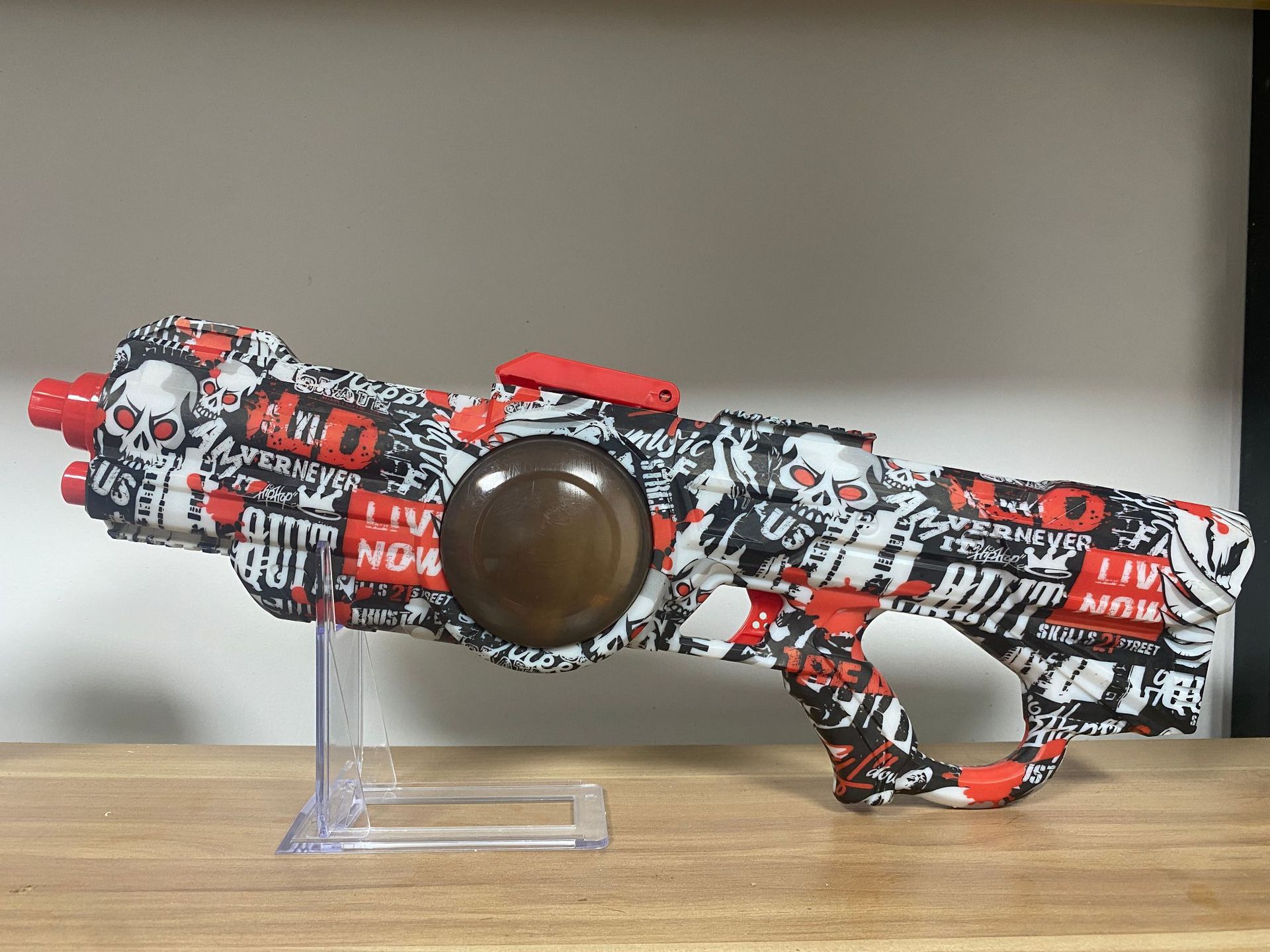 Pistola de agua eléctrica (cráneo de graffiti) caja de color inglés