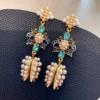 2507013 Dark blue bow rice bead bud earrings (S925 silver needle)