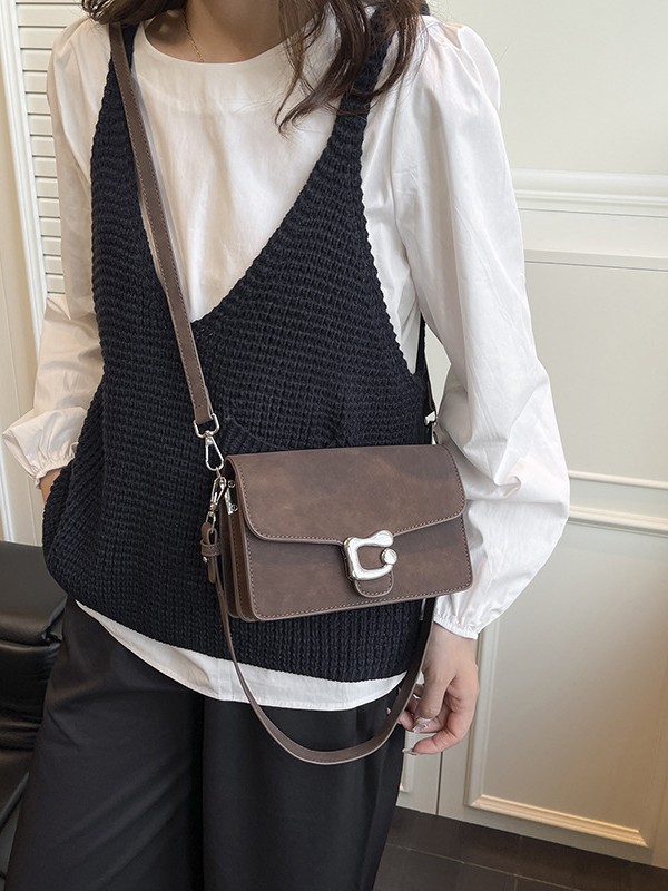 Nicho Zhong alta sensación de brazaleta bolso para mujeres 2025 nuevo cross-border retro texturas de moda mochila bolso pequeño