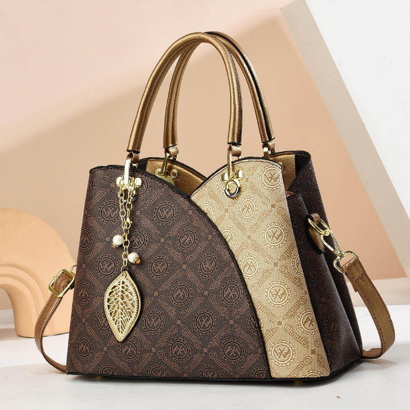 2025 verano nuevo bolso de moda de mediana edad bolso de mujer bolso de hombro mochila atmósfera bolso de madre universal