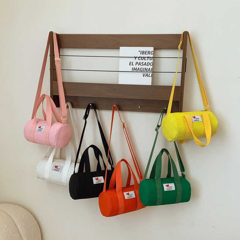 Bolsas de cubos coreanas para niños y niñas, letras de aire extranjero, bolsas de viaje casuales para niños, 2025 nuevas bolsas de lona para niños