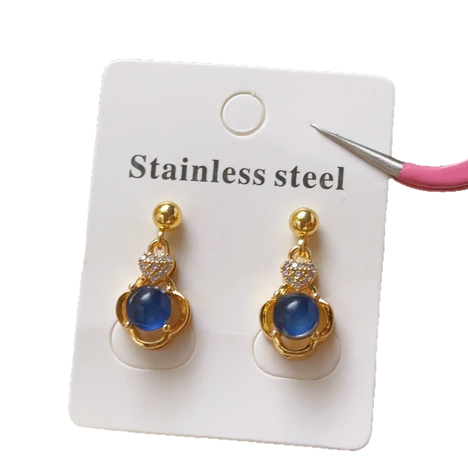 Elegante Europa y América nueva flor de cobre micro-pantalón de piedra de diamante temperamento lujoso hueco collar de diamante azul pernos de orejas para mujeres