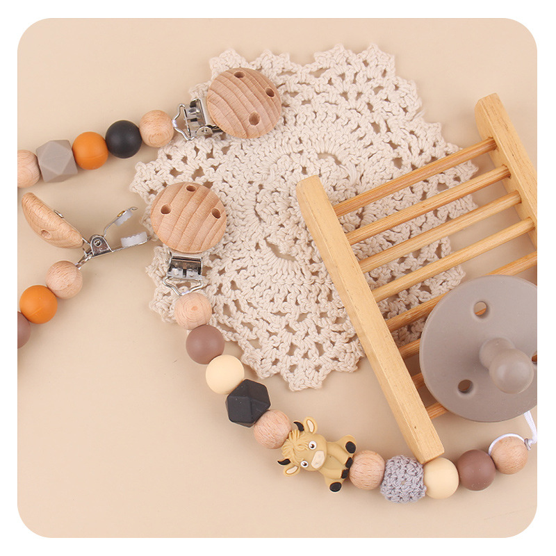 Productos para bebés abrazadera de chupeta de beech creativa caricatura estereoscópica buey silicona mordida de dientes molares cadena de chupeta de prevención