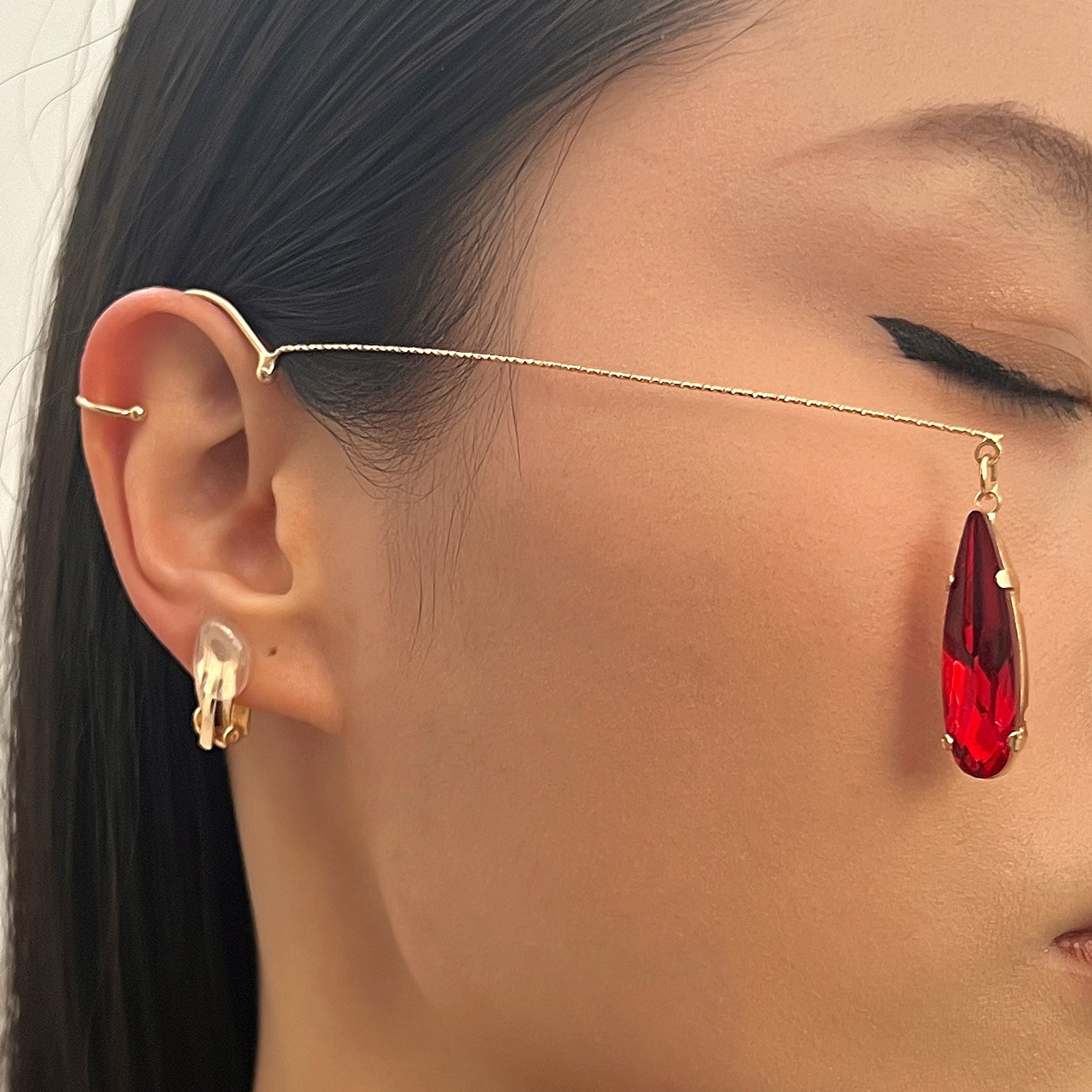 Long, teardrop-shaped crystal drop earrings, clip-on style, no ear piercing required. Features a luxurious design with tassels, perfect for adding a touch of elegance to any occasion