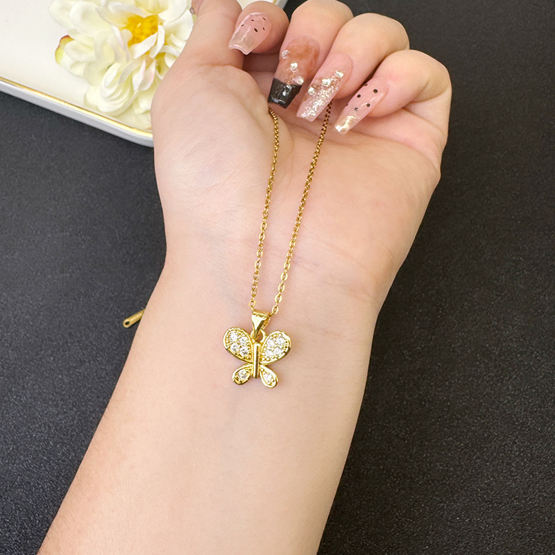 Vietnam Shajin nuevo estilo retro luz de lujo con incrustaciones de color collar de mariposa pendientes durante mucho tiempo sin decoloración joyería femenina de alta gama