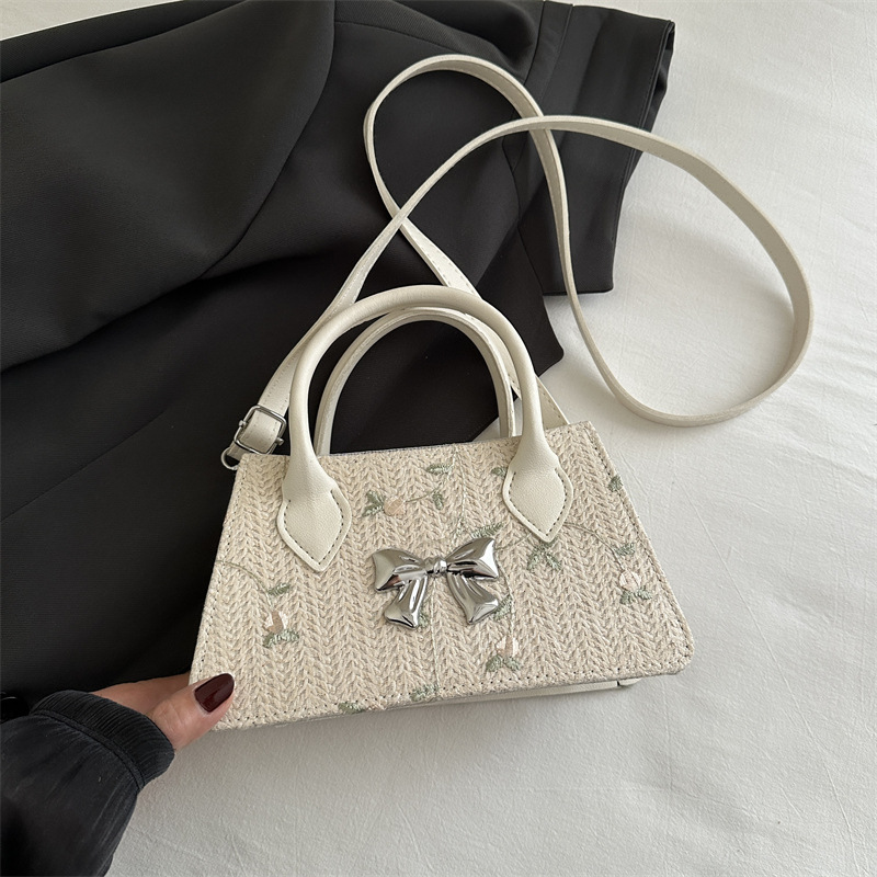 Moda de tejido de paja de primavera y verano 2025 nueva tendencia de encaje de paja estilo occidental bolso de mensajero de un solo hombro femenino