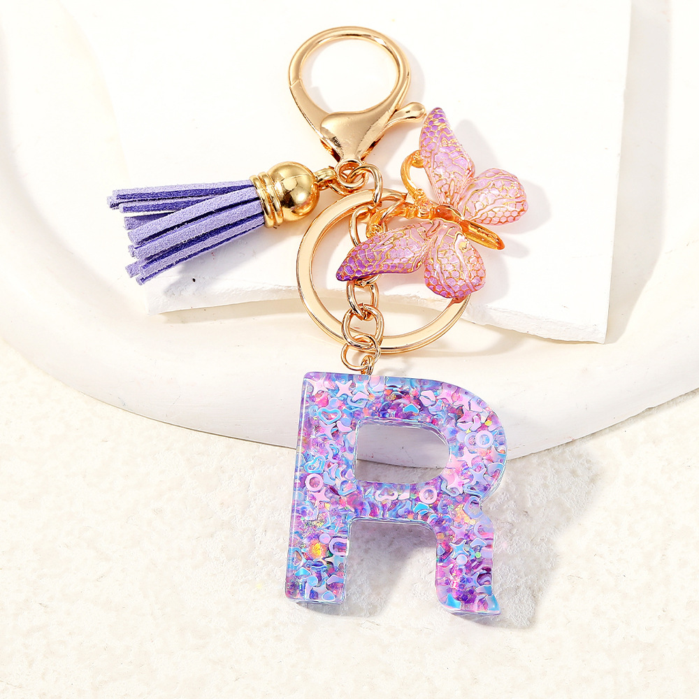 Mayorista transfronterizo mariposa esquinilla iniciales llavero de cristal goteo llavero de letras bolsos colgante