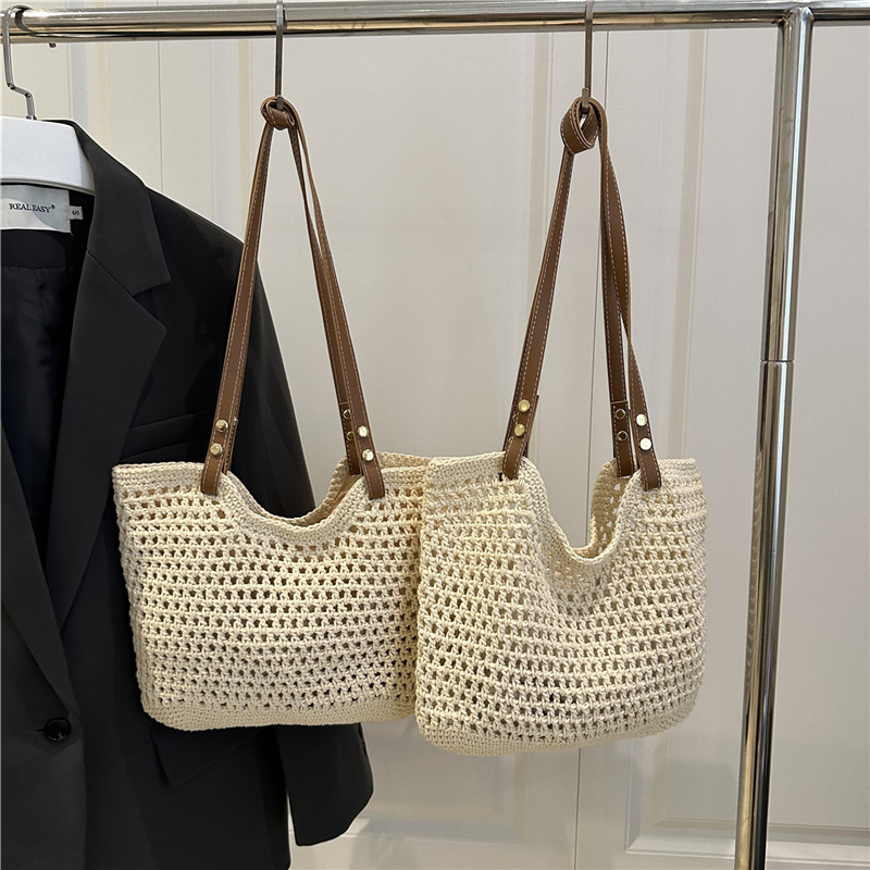 Bolsas de paja transfronterizas bolsas de mujer 2025 nueva moda simple gran capacidad bolsa de hombro hueco bolsa de playa bolsa de bolsa