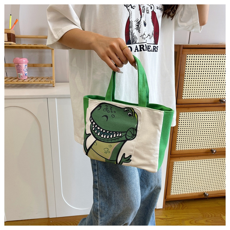 Cute cartoon printed small bag, 2024 summer new style hand-held piggy girl handbag, student storage canvas bag undefined