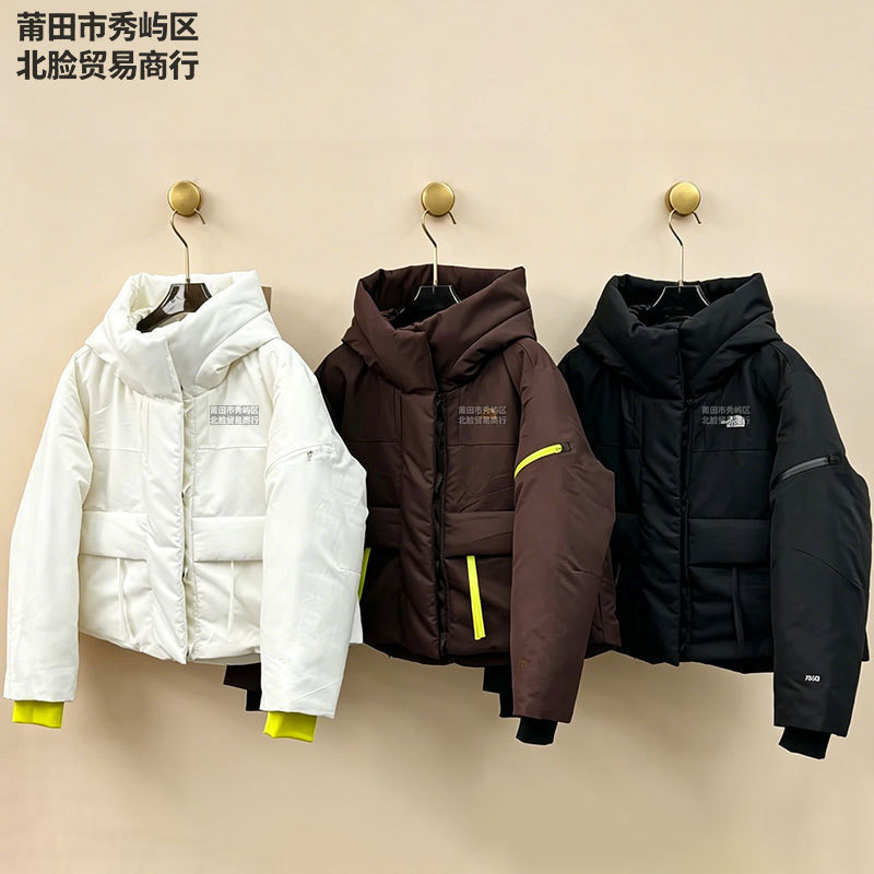 The North Face urban down jacket, TNFC, featuring a floral pattern, and a waterproof hooded outerwear The North Face urban down jacket, TNFC, featuring a floral pattern, and a waterproof hooded outerwear