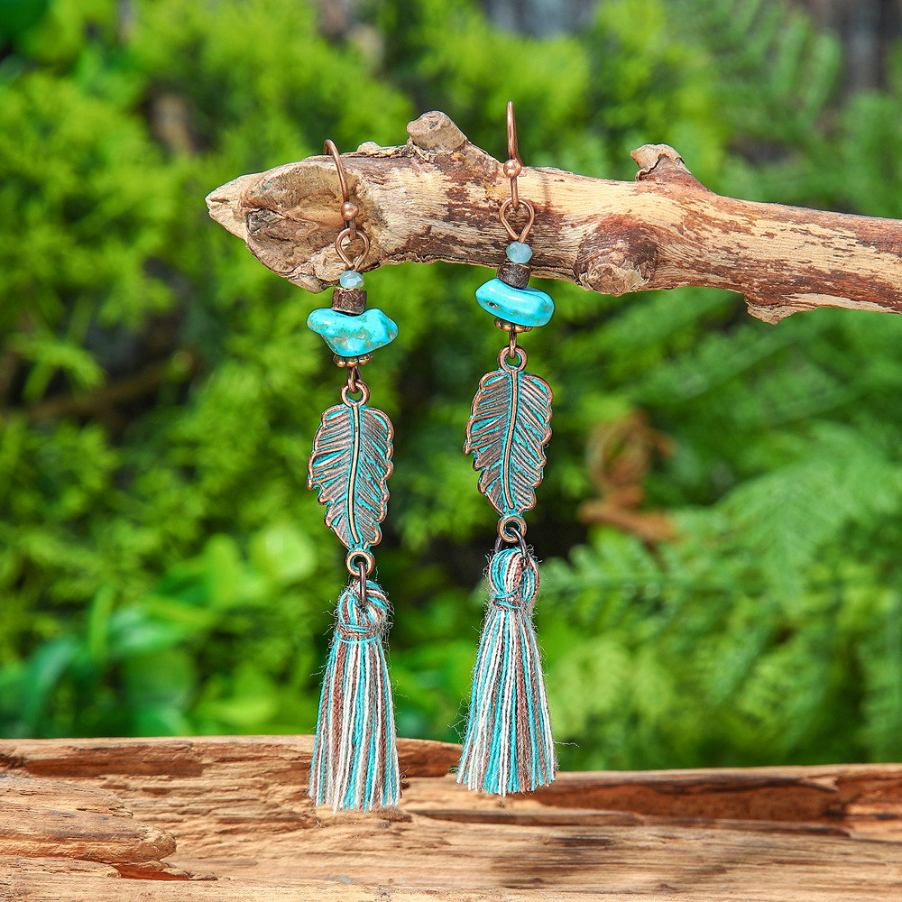New vintage leaf pendant earrings women's fashion hollow carved alloy tassel earrings European and American fashion jewelry batch