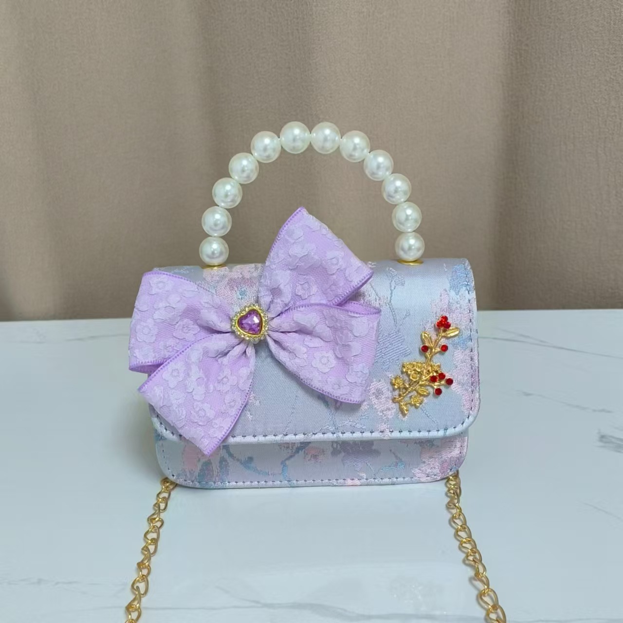 Bolso infantil nuevo bolso de hombro de niñas lindos bolsos de perlas de princesa arco de mariposa estilo nacional bolso de mochila pequeña bolsa
