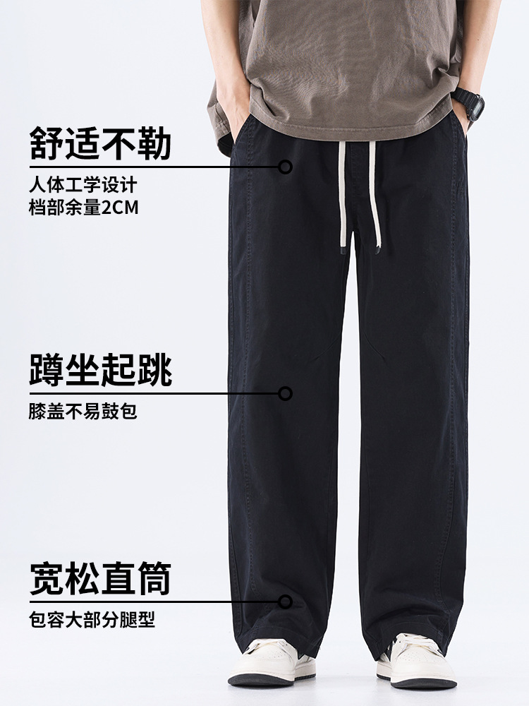 綿のカジュアルなズボンの男性のストレートのゆったりしているズボン2025夏の薄いタイプのファッションの防風傘兵の広い足のズボンの男性