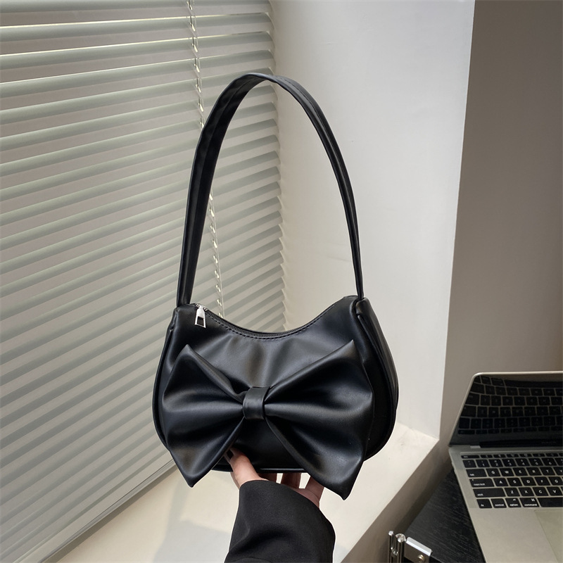 Bolso de axila con lazo de moda 2025 verano nuevo producto moda simple viajero estilo explosivo transfronterizo todo fósforo bolso femenino de un solo hombro