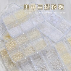 ネイルアートは円形の立体真珠の大きさを組み合わせて、小さな玉の平底の半円の純白の米の白い爪の装飾品を混ぜます。