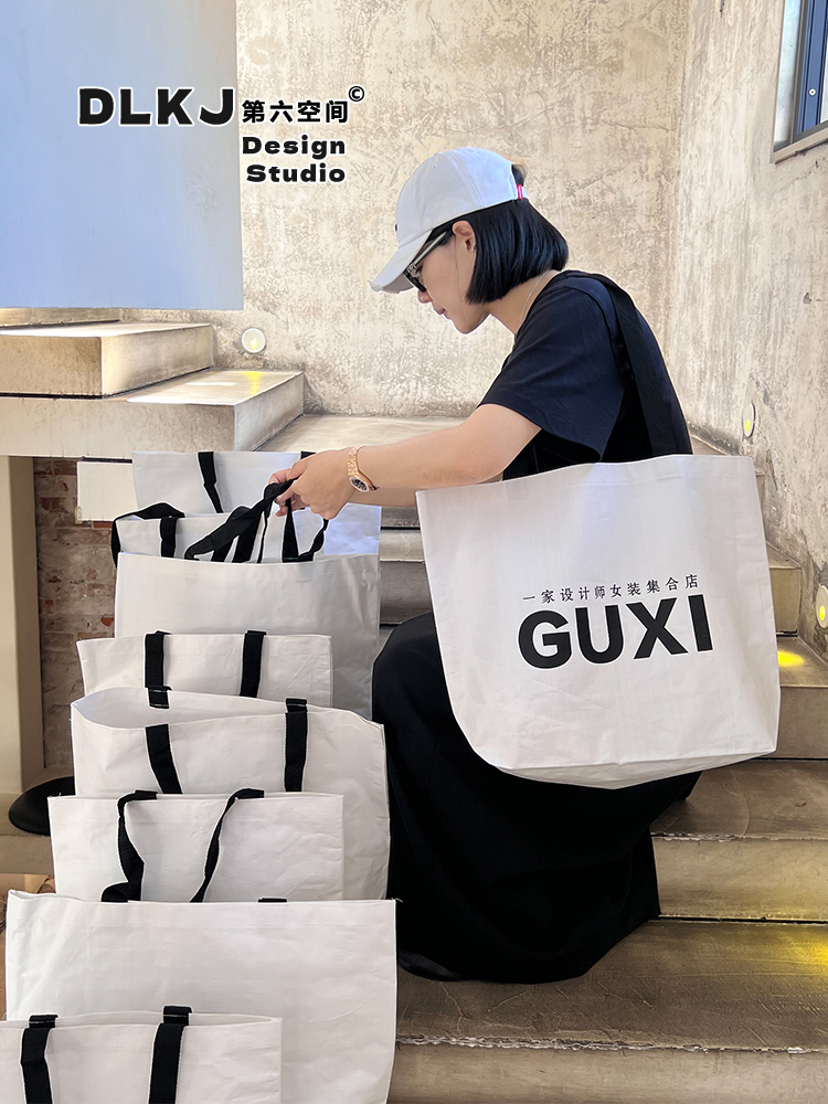 Tienda de ropa bolsa de tejido impresa LOGO ropa de mujer bolsa de compras regalos ropa al por mayor bolsa personalizada