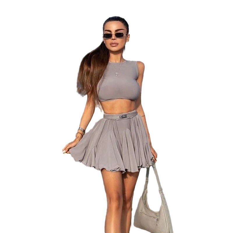 2025 transfronterizo Europa y América nueva moda de mujer estilo de vacaciones sexy chaleco con espalda abierta media falda casual de dos piezas para mujeres