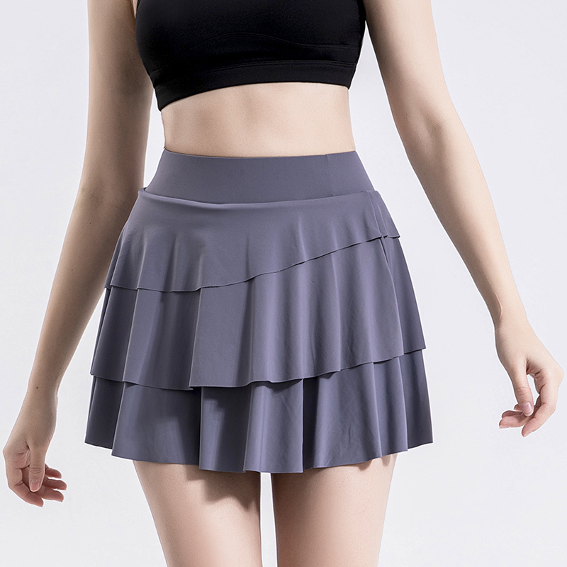 Yoga deportivo pantalones cortos sueltos falsos dos piezas de falda anti-descalzada secado rápido correr entrenamiento tenis pastel pantalones