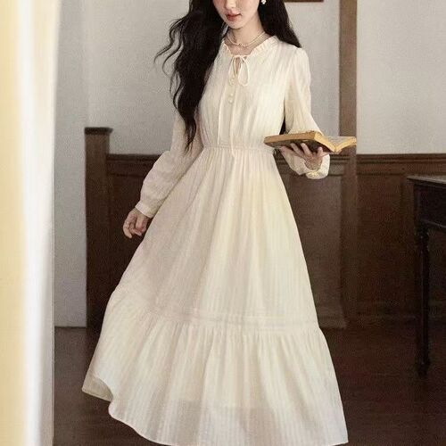 A women's autumn new style V-neck long-sleeved French-style apricot dress with 