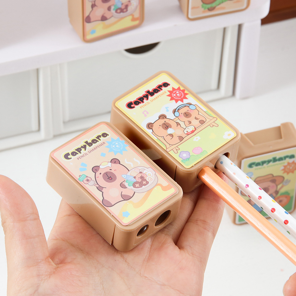 Capibala de doble agujero cuchillo de lápiz dibujos animados dibujo de lápiz cuchillo de transferencia de alto valor facial para estudiantes de primaria artículos de papelería