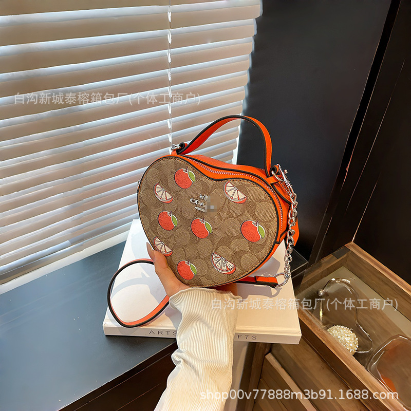 Bolso de mano en forma de corazón de comercio exterior, bolso de hombro de impresión de moda creativa, bolso de hombro simple, bolso de hombro de dama de Europa y América.