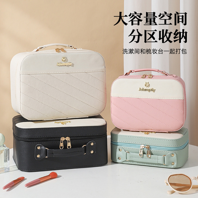 Bolsa de maquillaje de cuero mujer caja de almacenamiento de gran capacidad portátil caja de maquillaje portátil de alto valor cosmético bolsa de almacenamiento al por mayor