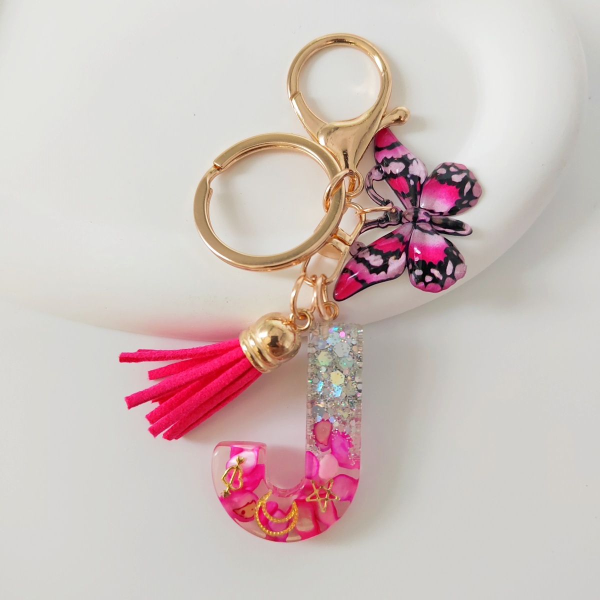 Inventario transfronterizo nueva resina bicolor mariposa borda llavero colgante estrella luna accesorios de joyas