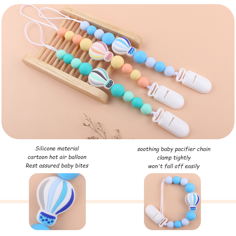 Nuevo bebé suministros chupete cadena creativa dibujos animados globo de aire caliente de silicona mordedura cadena anti-gota molar