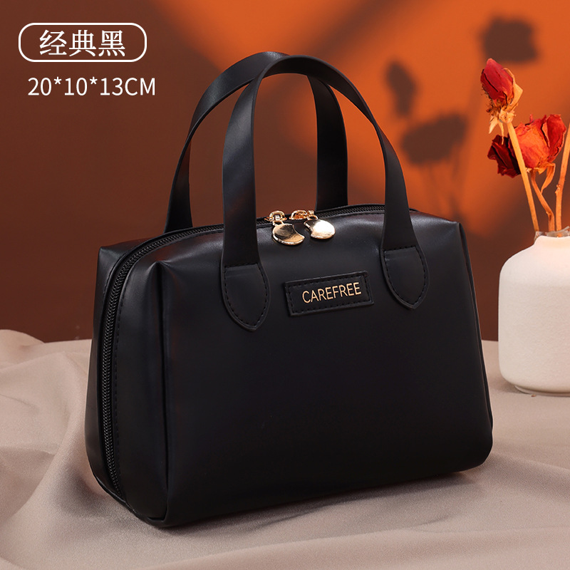 Luz de lujo francés pequeño bolso de maquillaje portátil multifuncional de alta calidad sensación de viaje bolsa de maquillaje portátil de mujer