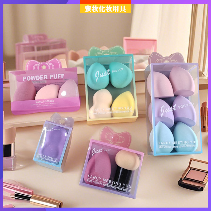 PVC caja transparente lindo huevo de maquillaje lindo expresión huevo de maquillaje colorido no látex agua se vuelve más grande esponja polvo de maquillaje