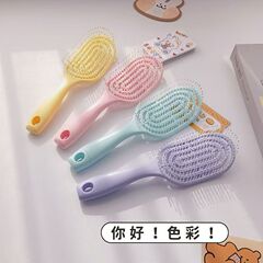 現品の新商品のマカロンのふわふわしている骨の櫛のマッサージの形の女性の家庭用の髪の櫛の透かし彫りの櫛の骨の櫛の卸売り