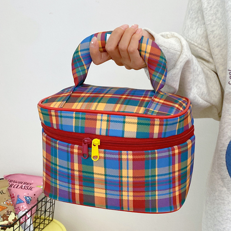 Handheld capacious cosmetic bag