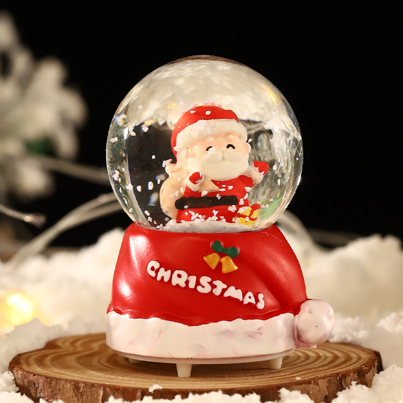 Una variedad de regalos de decoración de Navidad Navidad iluminante bola de cristal caja de música ventana diseño de velas lámparas de viento árbol de Navidad