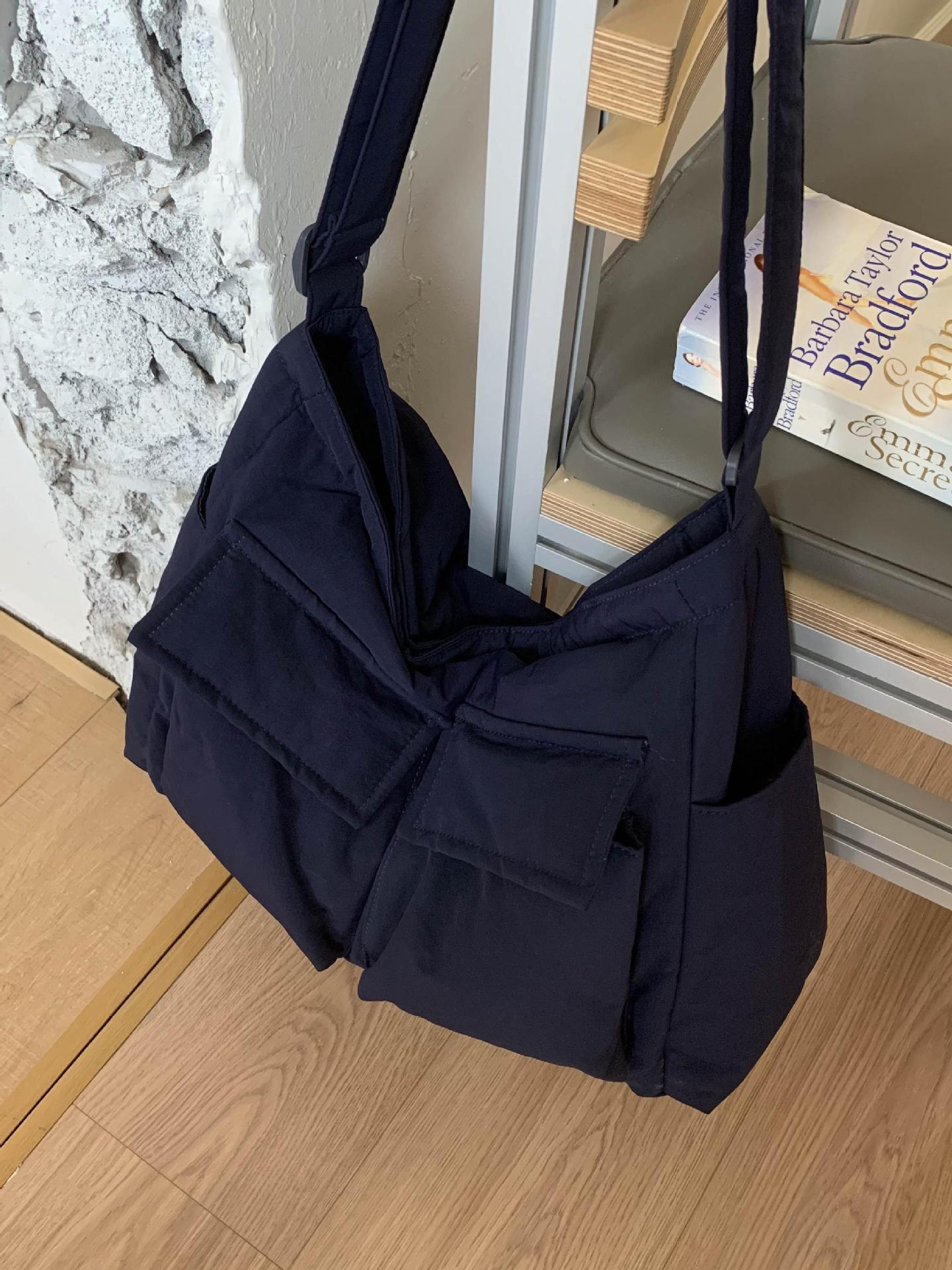 Bolsa de lona de explosión de comercio exterior para mujeres 2025 nuevo viaje multibolsillo bolso de gran capacidad para trabajar mochila de hombro