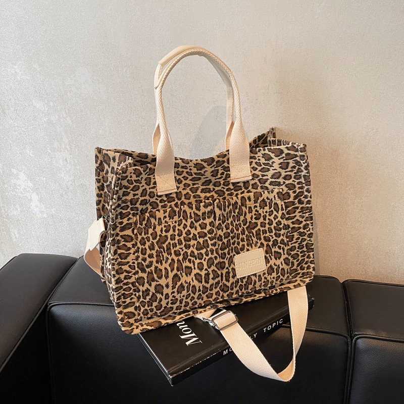 Leopardo tela bolsa de tela para mujeres bolsa de gran capacidad 2024 nuevo estilo relajado sensación de mano viaje bolsa de hombro de mamá