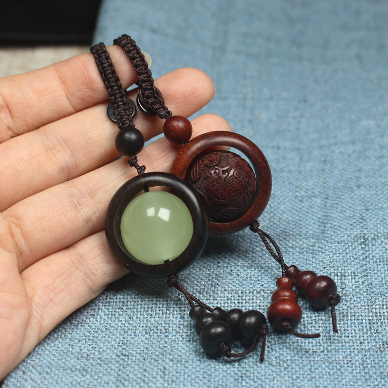 Factory wholesale Ebony running fluorescent mobile phone pendant blood sandalwood keychain bag pendant Wenwan crafts