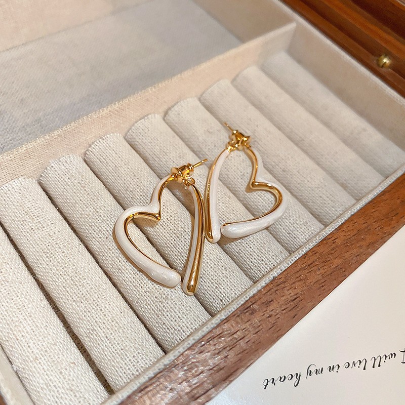 Aguja de plata flor pendientes geométricos pendientes dulces pequeños frescos de Corea del Sur ins moda nicho pendientes