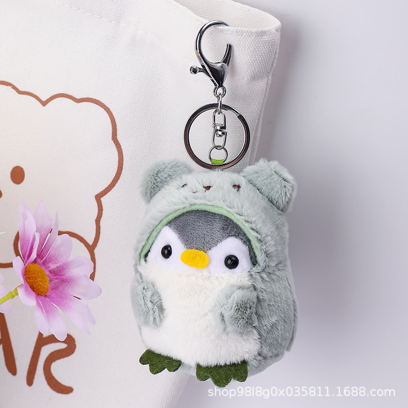 かわいいアニメ旅行ペンギンのリュックサックは子供のキーホルダーのぬいぐるみのプレゼントを掛けます。|undefined