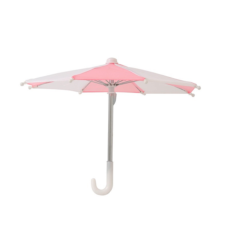Pink and white toy umbrella