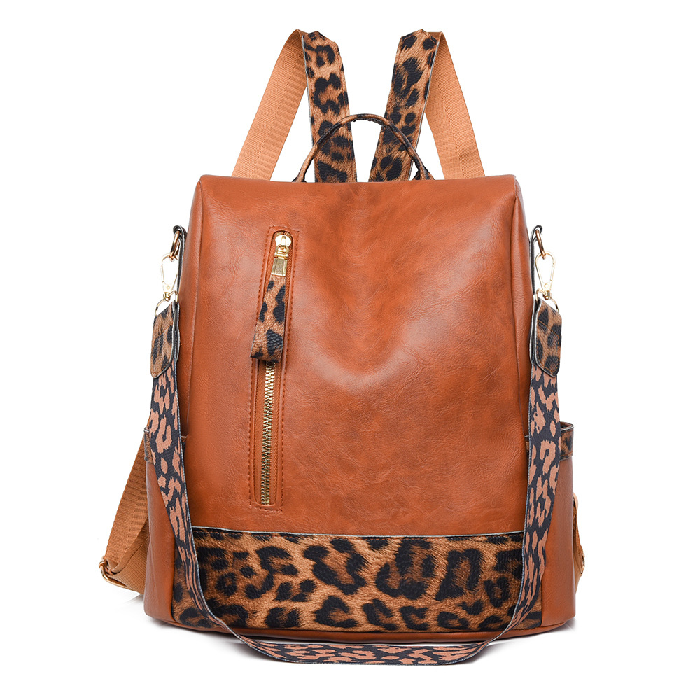 Fabricantes al por mayor 2025 nueva mochila de cuero suave para damas retro europeas y americanas moda estampado de leopardo contraste color bolso de mochila antirrobo