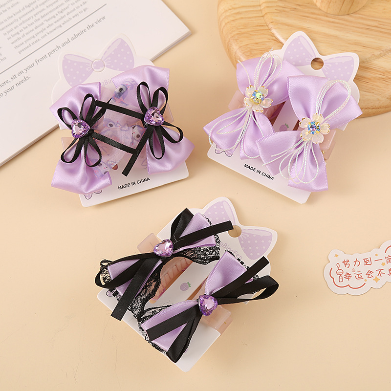 Purple children's hairgrip with bow