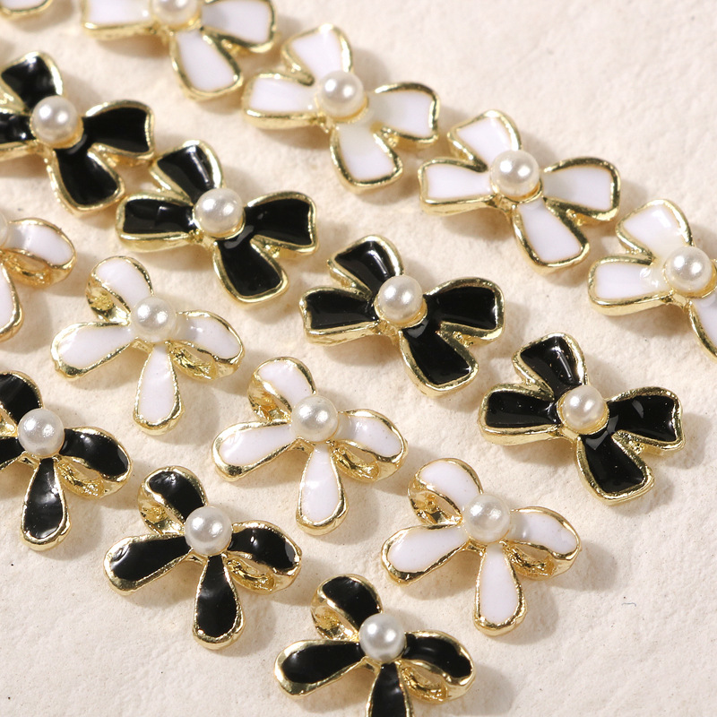 Arco de uñas joyería negro blanco Chanel estilo 2022 nuevo barroco perla clavo diamante neto popular