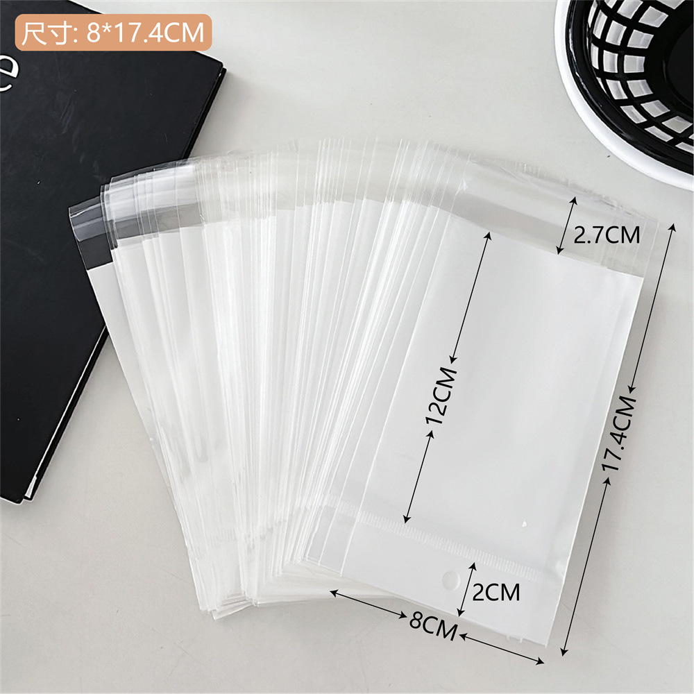 Colección de bolsas opp transparentes, cabeza de tarjeta, bolsa de embalaje trasera, bolsa de joyería pequeña, bolsa autoadhesiva con orificio colgante, bolsa de embalaje de plástico al por mayor