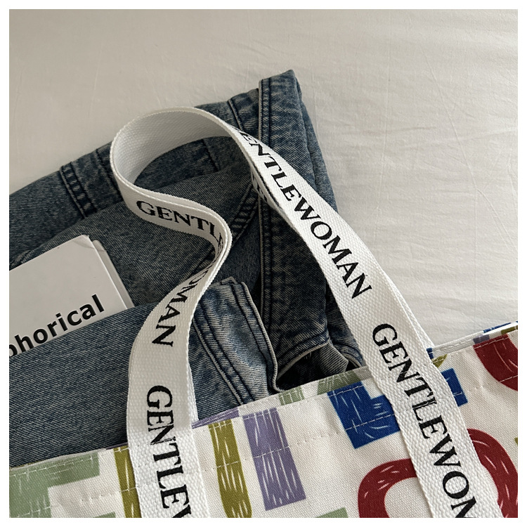 Large-capacity letter canvas bag 2025 new style ins printed versatile shoulder bag for commuting and portable ladies' tote bag undefined