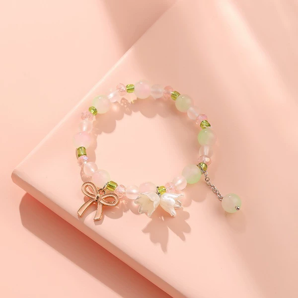 Green bracelet with bow, orchid