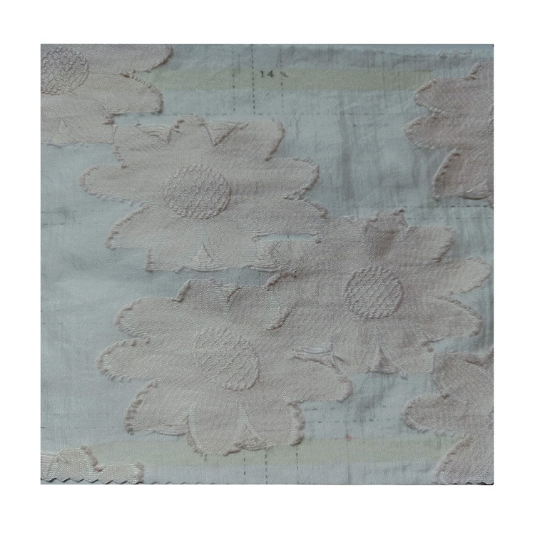 春夏时尚女装童装连衣裙蓬裙面料锦涤混纺剪花提花布欧锦提花现货