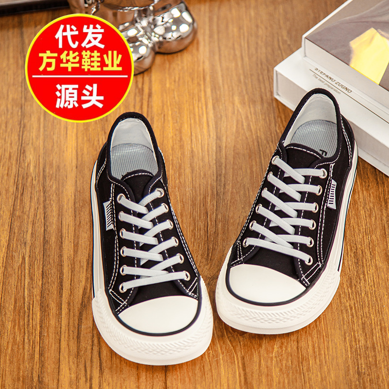 2026 primavera y verano nuevos zapatos de lona de mujer de altura baja con suela gruesa delantera correa de abertura superficial zapatos de lona casuales de estudiantes