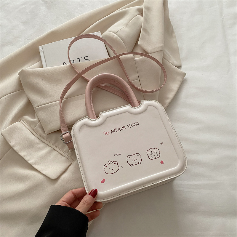 Bolso pequeño de nicho femenino 2025 primavera y verano nuevo estilo bolso bandolera de textura blanca con sentido de diseño bolso de galleta portátil pequeño bolso cuadrado